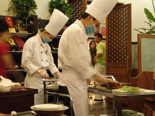 Peking duck being carved